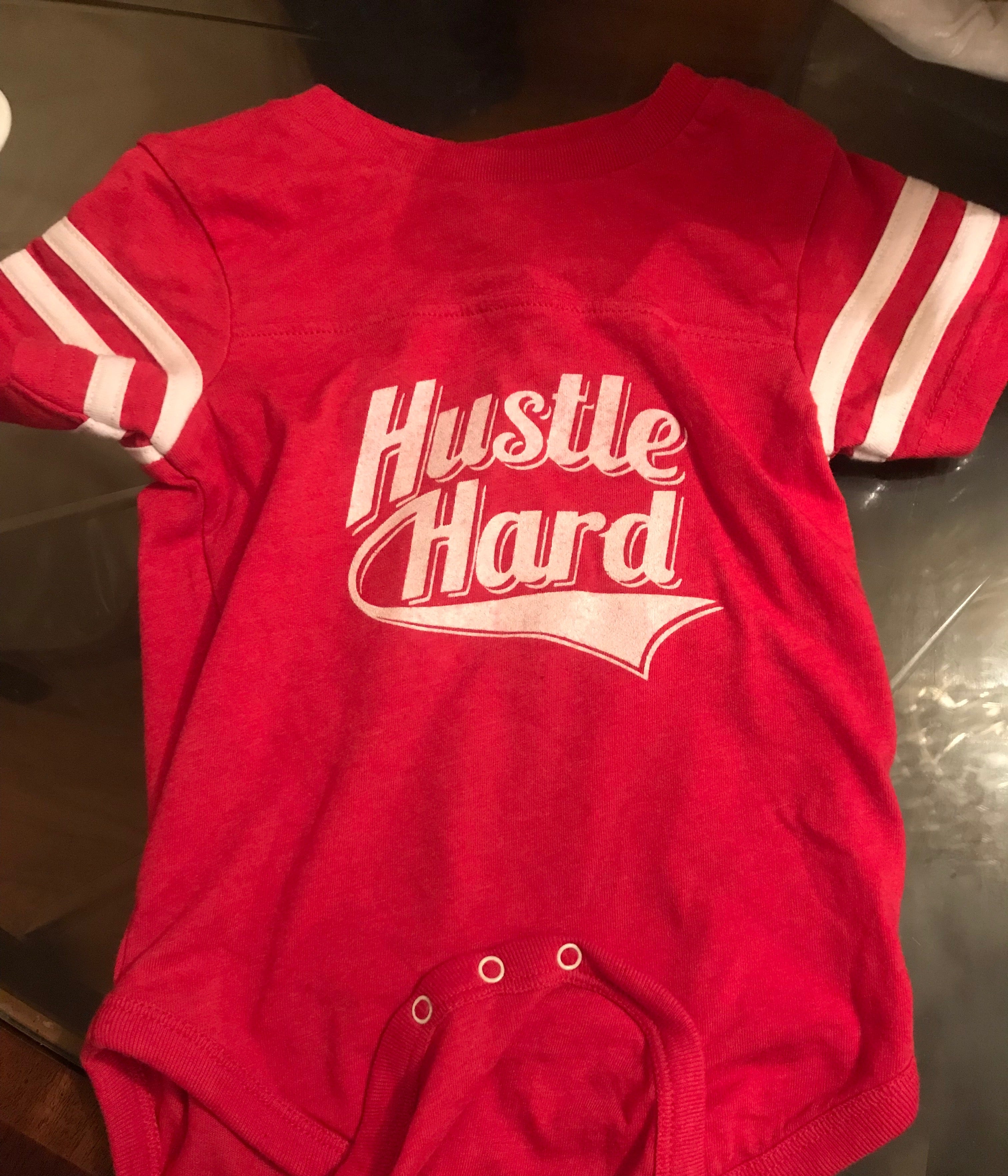 HUSTLE HARD ONESIES