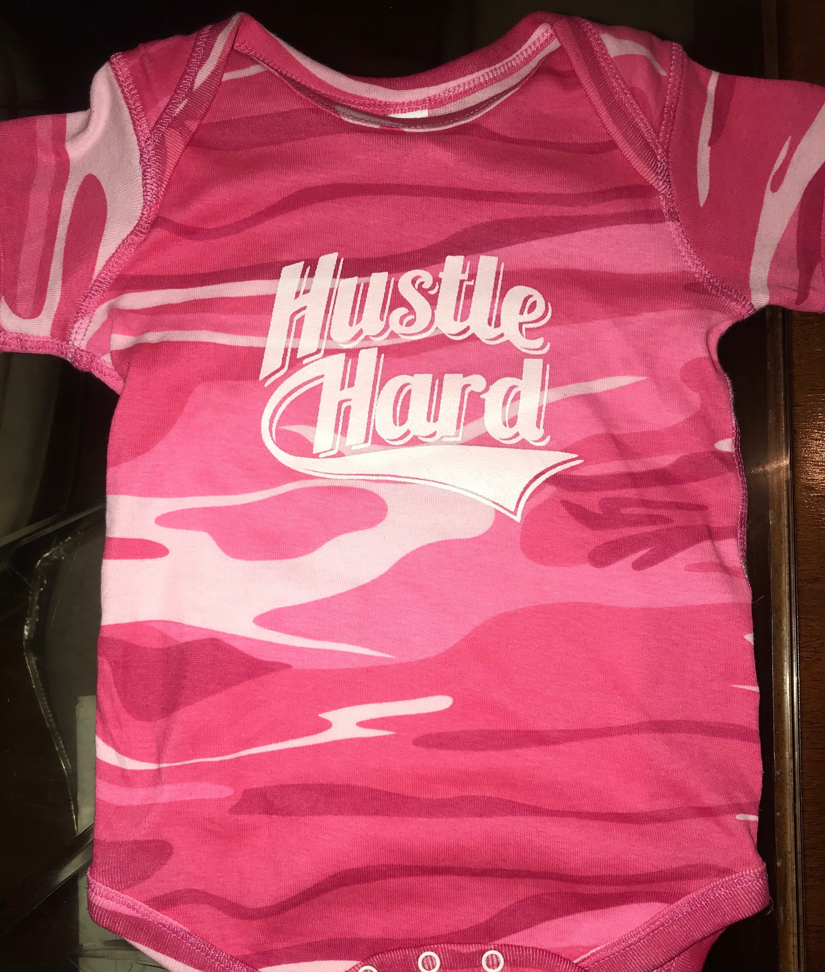 HUSTLE HARD ONESIES